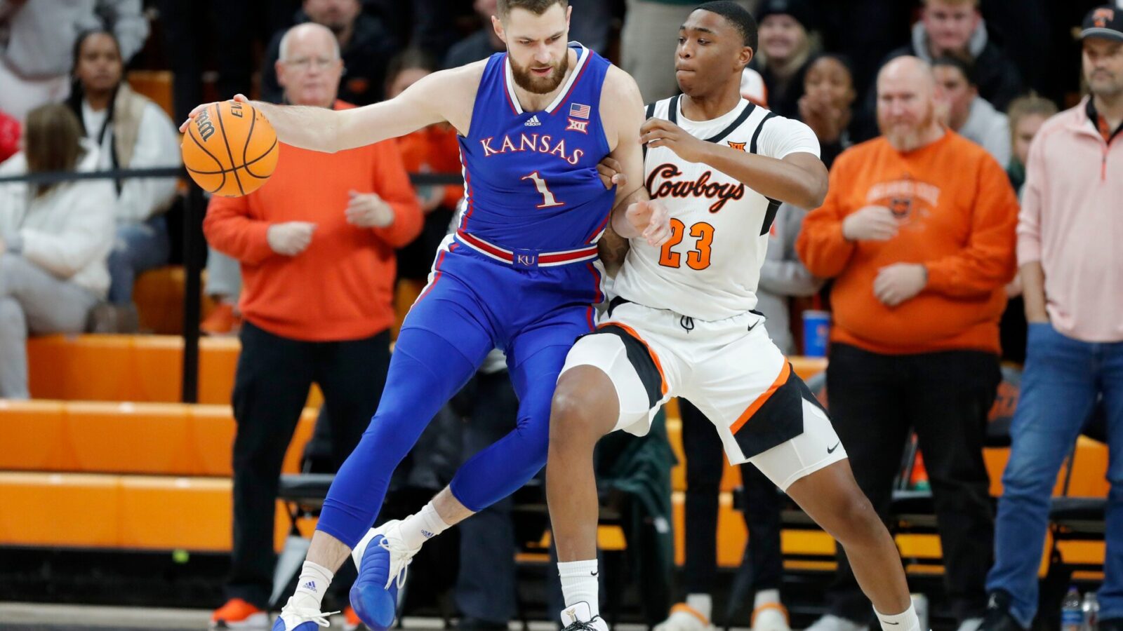 Oklahoma State Cowboys center Brandon Garrison (23) defends Kansas Jayhawks center Hunter Dickinson (1) during a college basketball game between the Oklahoma State University Cowboys (OSU) and the Kansas Jayhawks at Gallagher-Iba Arena in Stillwater, Okla., Tuesday, Jan. 16, 2024.