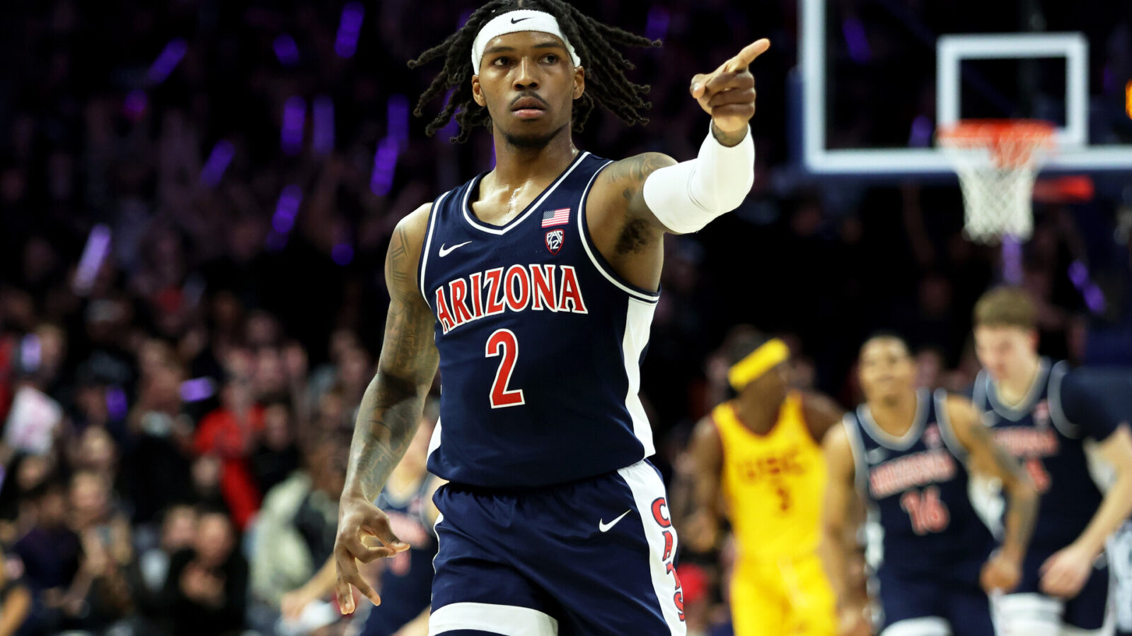 Jan 17, 2024; Tucson, Arizona, USA; Arizona Wildcats guard Caleb Love (2) celebrates a three point basket with the Arizona Wildcats bench against the USC Trojansduring the first half at McKale Center.