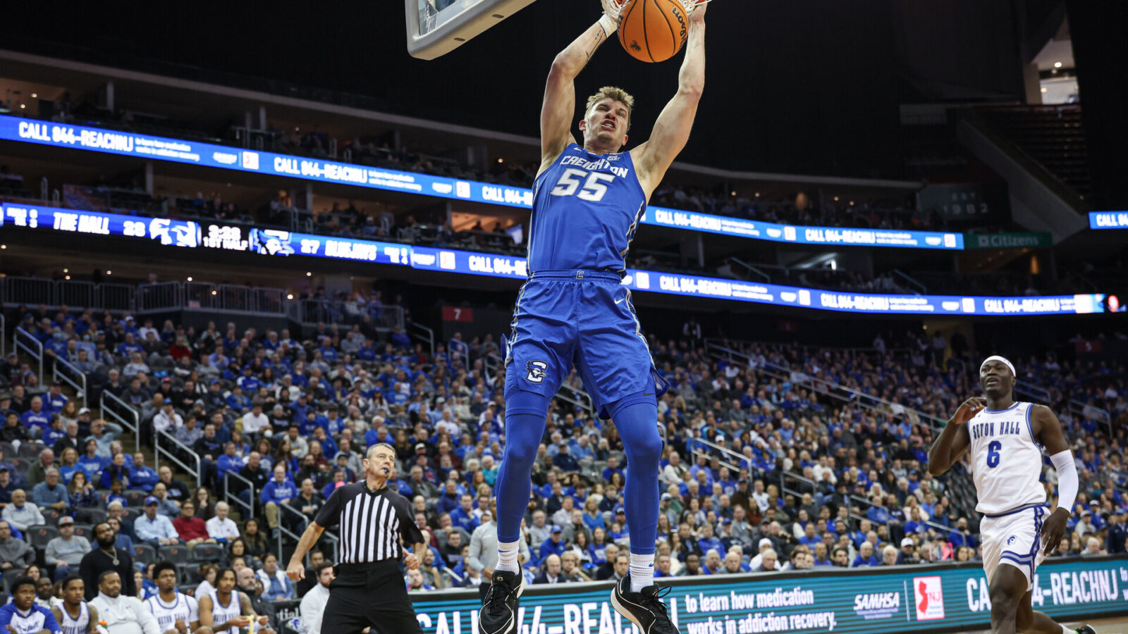 Jan 20, 2024; Newark, New Jersey, USA; Creighton Bluejays guard Baylor Scheierman (55) dunks the ball in front of Seton Hall Pirates forward David Tubek (6) during the first half at Prudential Center.