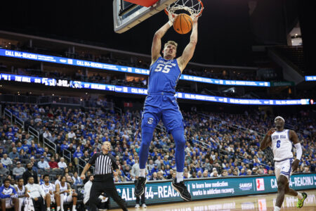Jan 20, 2024; Newark, New Jersey, USA; Creighton Bluejays guard Baylor Scheierman (55) dunks the ball in front of Seton Hall Pirates forward David Tubek (6) during the first half at Prudential Center.