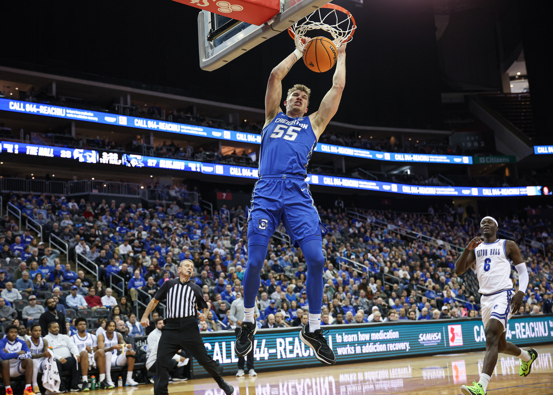 Jan 20, 2024; Newark, New Jersey, USA; Creighton Bluejays guard Baylor Scheierman (55) dunks the ball in front of Seton Hall Pirates forward David Tubek (6) during the first half at Prudential Center.