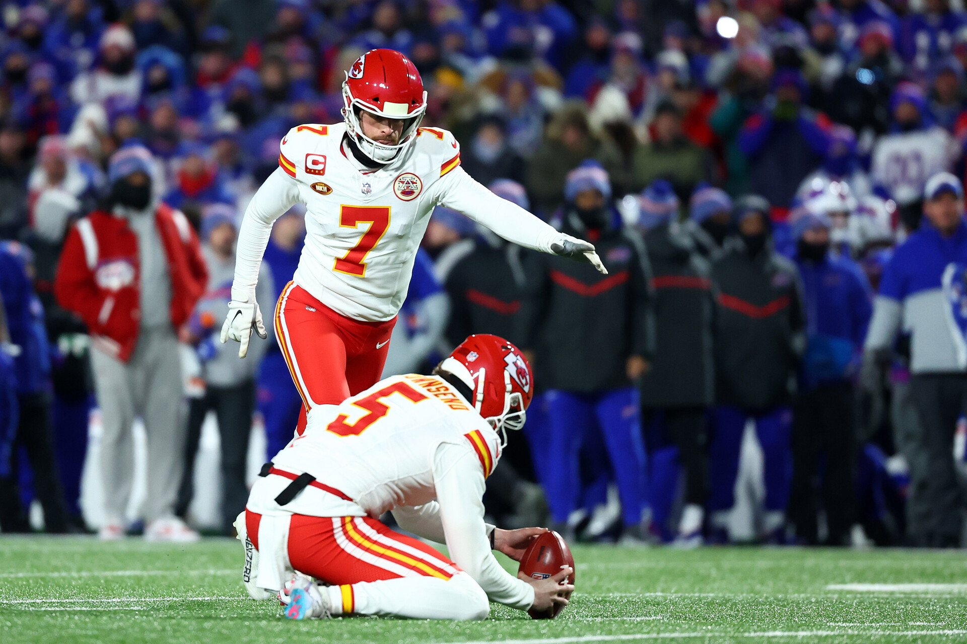 Jan 21, 2024; Orchard Park, New York, USA; Kansas City Chiefs place kicker Harrison Butker (7) kicks a field goal against the Buffalo Bills during the first half for the 2024 AFC divisional round game at Highmark Stadium.