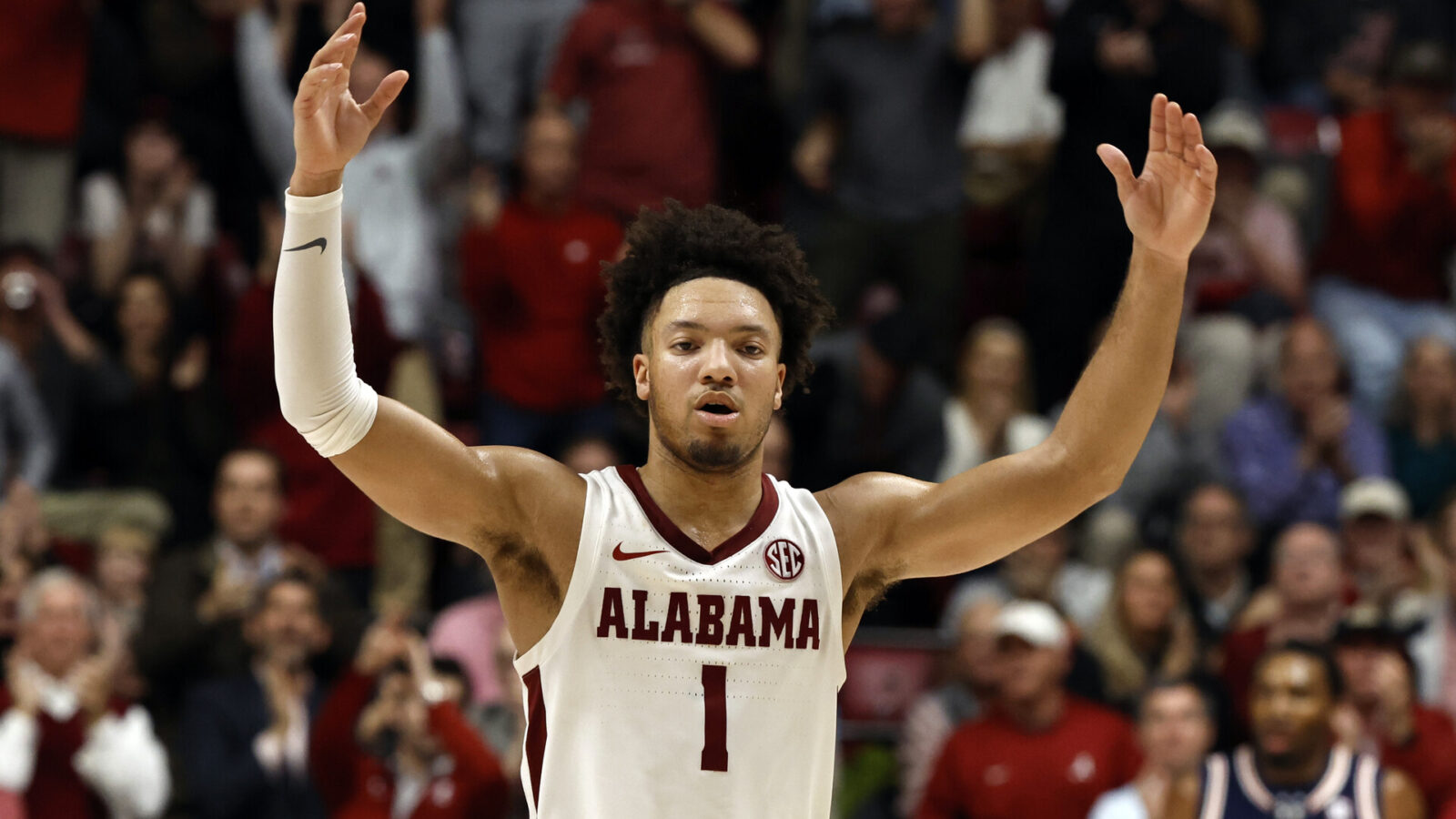 Alabama Crimson Tide guard Mark Sears (1) celebrates after a score against the Auburn Tigers during the second half at Coleman Coliseum.