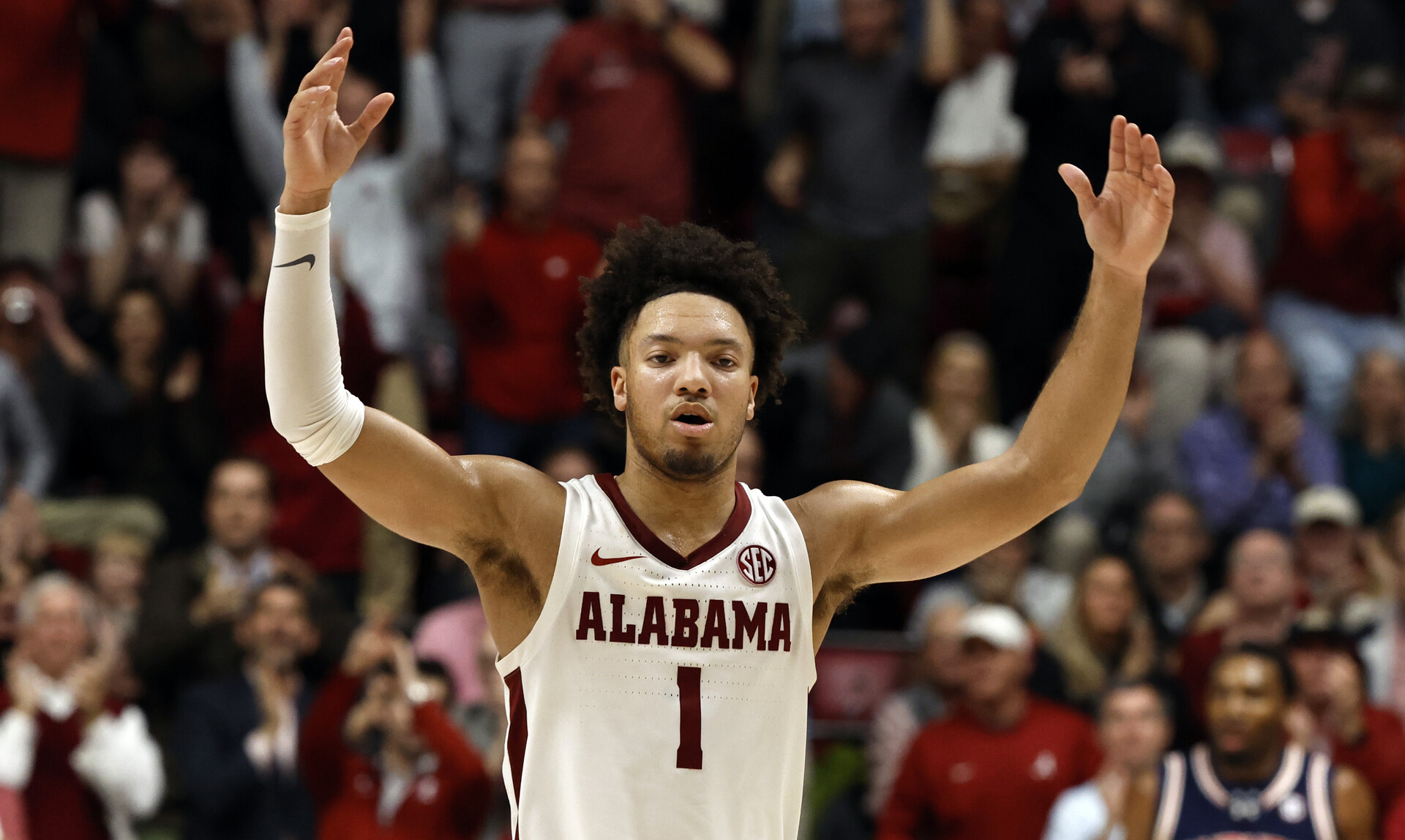 Alabama Crimson Tide guard Mark Sears (1) celebrates after a score against the Auburn Tigers during the second half at Coleman Coliseum.