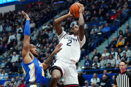 Jan 28, 2024; Hartford, Connecticut, USA; UConn Huskies guard Tristen Newton (2) shoots against Xavier Musketeers guard Dayvion McKnight (20) in the first half at XL Center