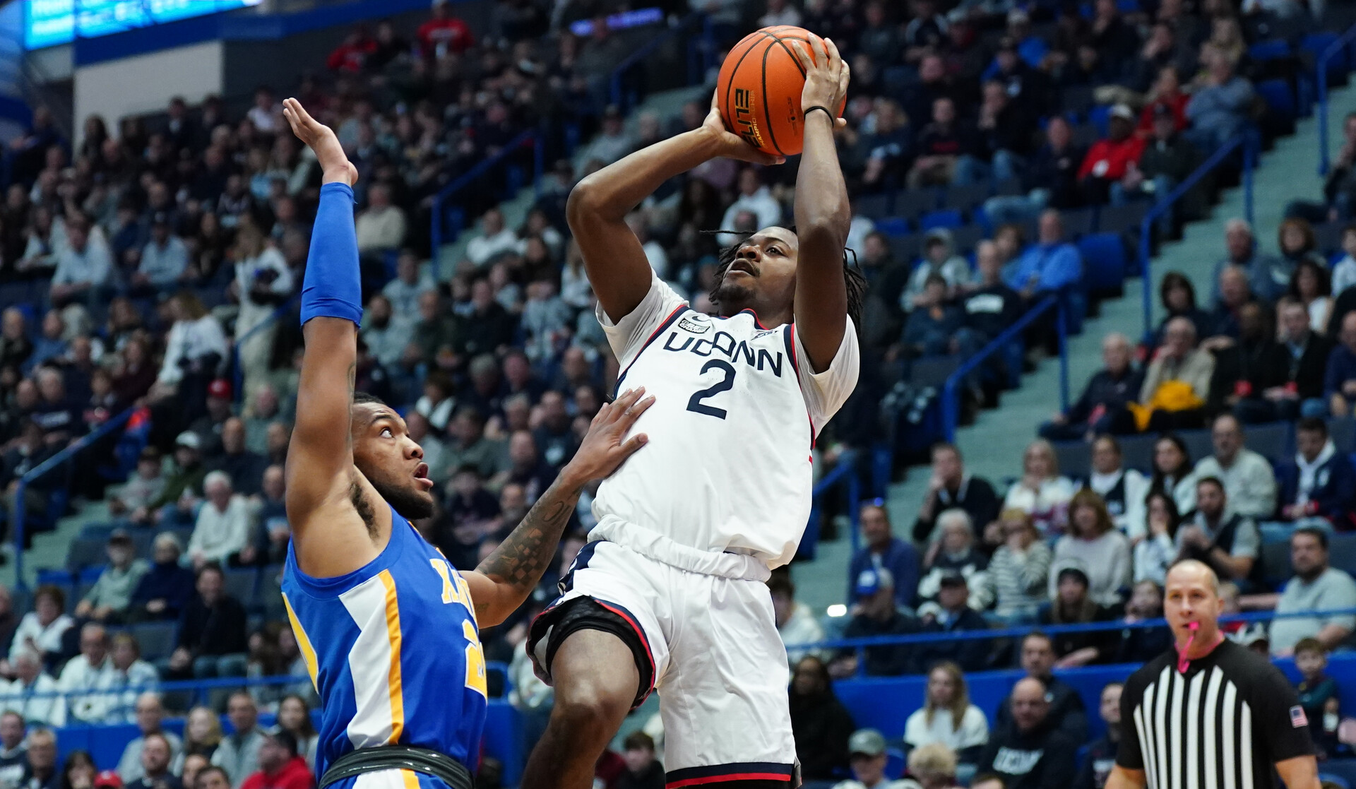 Jan 28, 2024; Hartford, Connecticut, USA; UConn Huskies guard Tristen Newton (2) shoots against Xavier Musketeers guard Dayvion McKnight (20) in the first half at XL Center