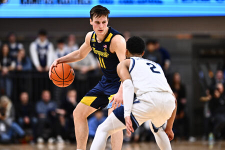 Jan 30, 2024; Villanova, Pennsylvania, USA; Marquette Golden Eagles guard Tyler Kolek (11) controls the ball against Villanova Wildcats guard Mark Armstrong (2) in the second half at William B. Finneran Pavilion.