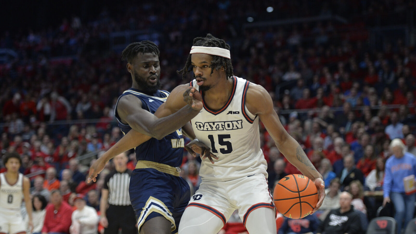 Jan 30, 2024; Dayton, Ohio, USA; Dayton Flyers forward DaRon Holmes II (15) drives to the basket against George Washington center Babatunde Akingbola (23) during a game at University of Dayton Arena.