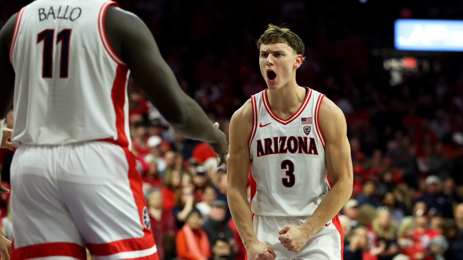 Feb 4, 2024; Tucson, Arizona, USA; Arizona Wildcats guard Pelle Larsson (3) celebrates with Arizona Wildcats center Oumar Ballo (11) after he scored a basket agaisnt the Stanford Cardinal during the second half at McKale Center.
