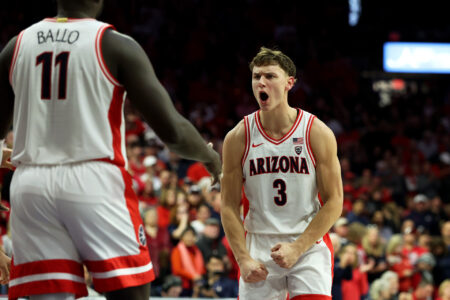 Feb 4, 2024; Tucson, Arizona, USA; Arizona Wildcats guard Pelle Larsson (3) celebrates with Arizona Wildcats center Oumar Ballo (11) after he scored a basket agaisnt the Stanford Cardinal during the second half at McKale Center.