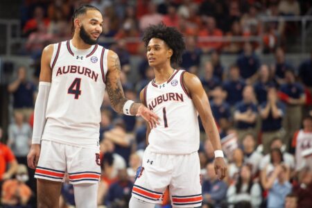 Auburn Tigers forward Johni Broome (4) and guard Aden Holloway (1) talk during free throws as Auburn Tigers take on Alabama Crimson Tide at Neville Arena in Auburn, Ala., on Wednesday, Feb. 7, 2024. Auburn Tigers defeated Alabama Crimson Tide 99-81.