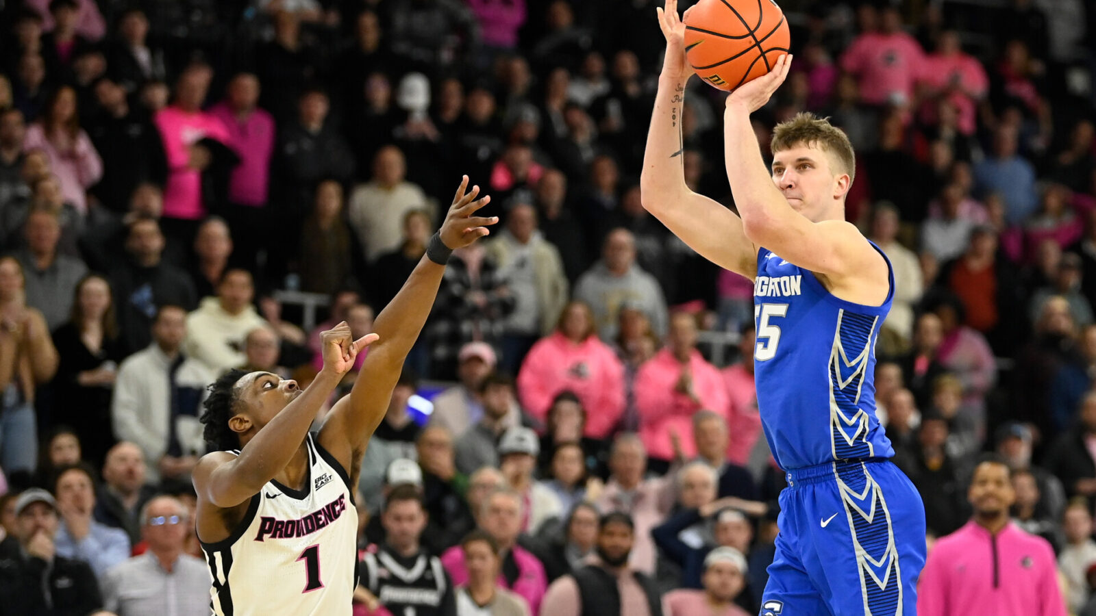 Feb 7, 2024; Providence, Rhode Island, USA; Creighton Bluejays guard Baylor Scheierman (55) shoots over Providence Friars guard Jayden Pierre (1) during overtime at Amica Mutual Pavilion.