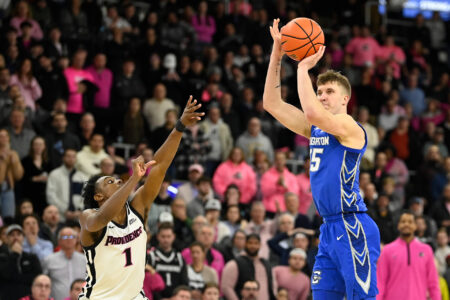 Feb 7, 2024; Providence, Rhode Island, USA; Creighton Bluejays guard Baylor Scheierman (55) shoots over Providence Friars guard Jayden Pierre (1) during overtime at Amica Mutual Pavilion.