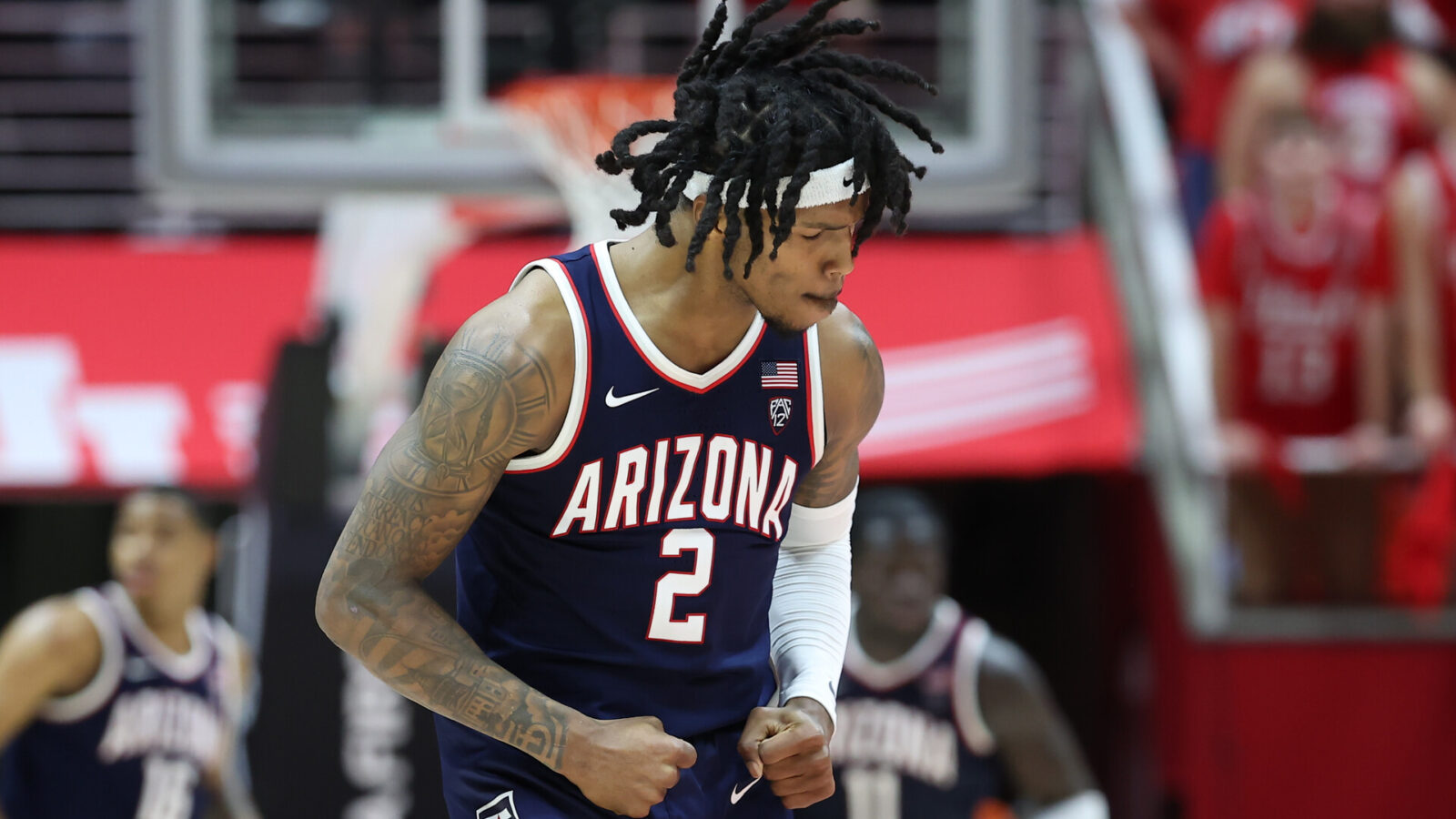 Arizona Wildcats guard Caleb Love (2) celebrates a shot against the Utah Utes during third overtime at Jon M. Huntsman Center.