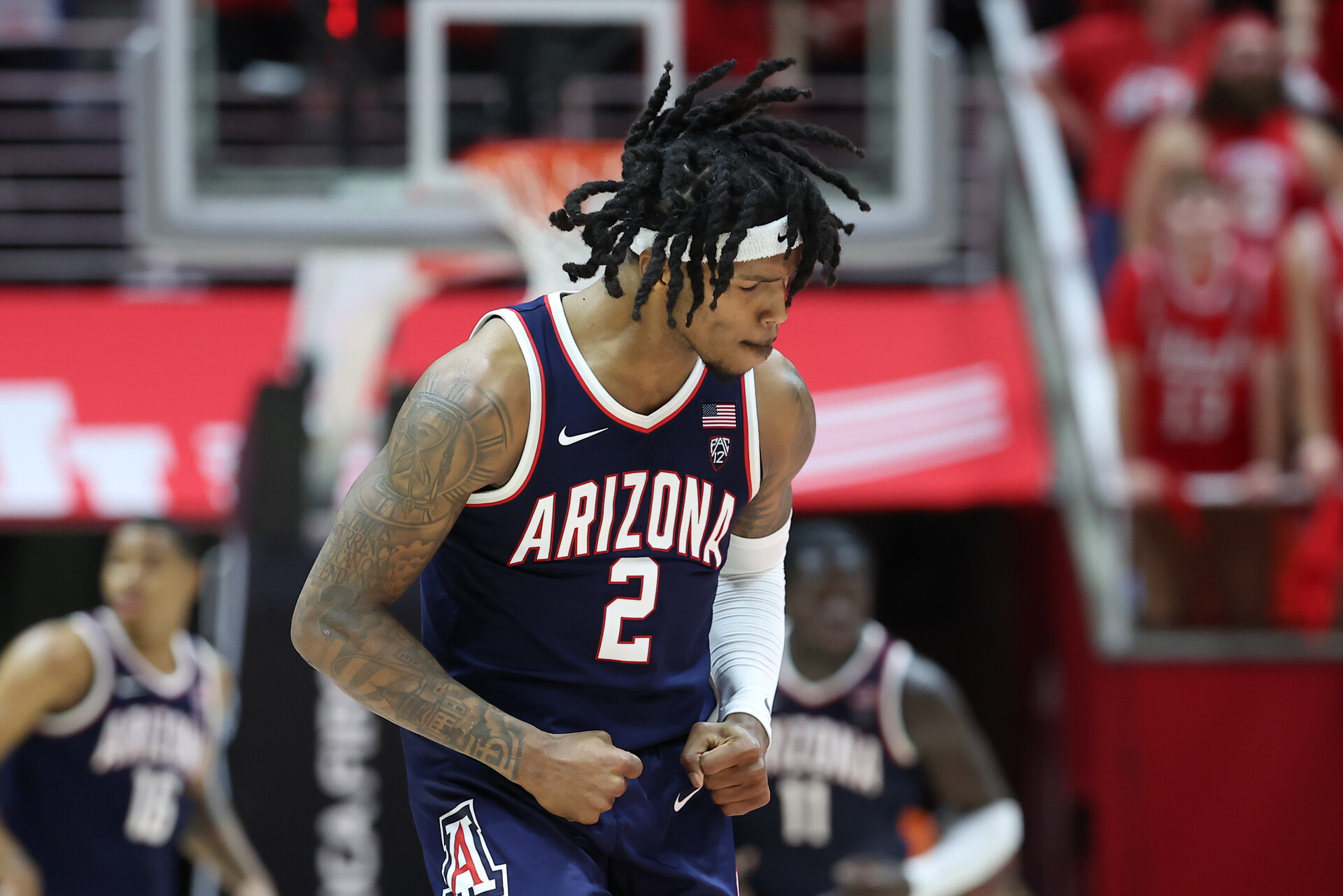 Arizona Wildcats guard Caleb Love (2) celebrates a shot against the Utah Utes during third overtime at Jon M. Huntsman Center.