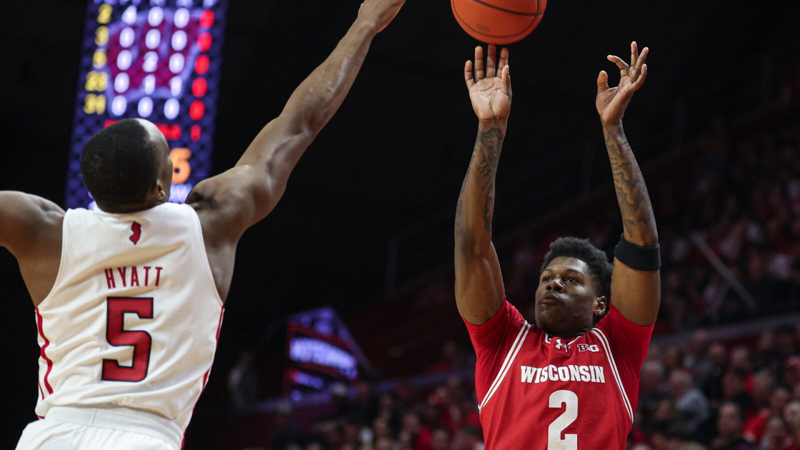 Feb 10, 2024; Piscataway, New Jersey, USA; Wisconsin Badgers guard AJ Storr (2) shoots the ball against Rutgers Scarlet Knights forward Aundre Hyatt (5) during the first half at Jersey Mike's Arena.