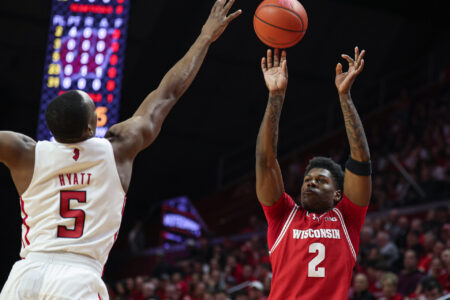 Feb 10, 2024; Piscataway, New Jersey, USA; Wisconsin Badgers guard AJ Storr (2) shoots the ball against Rutgers Scarlet Knights forward Aundre Hyatt (5) during the first half at Jersey Mike's Arena.