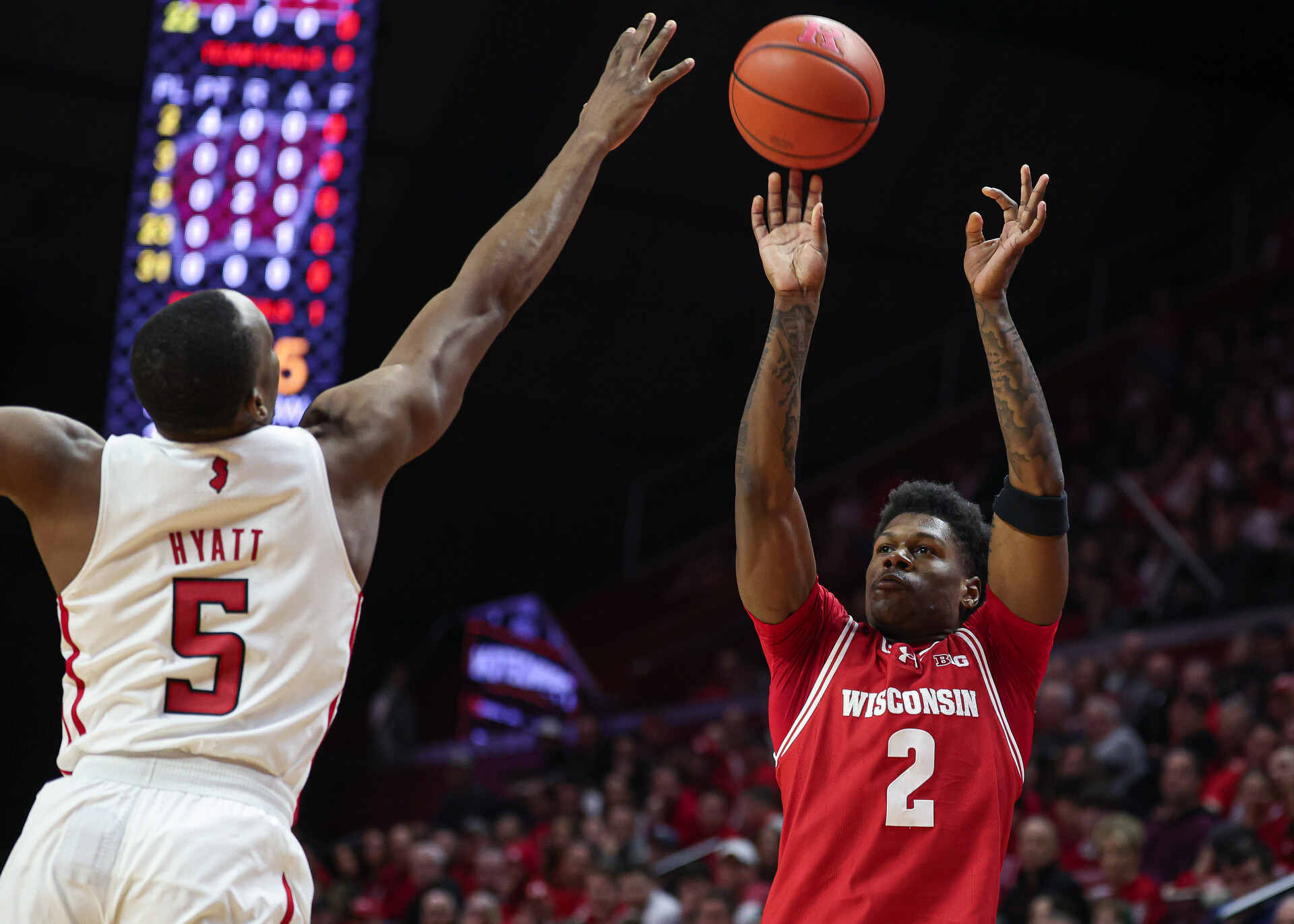 Feb 10, 2024; Piscataway, New Jersey, USA; Wisconsin Badgers guard AJ Storr (2) shoots the ball against Rutgers Scarlet Knights forward Aundre Hyatt (5) during the first half at Jersey Mike's Arena.