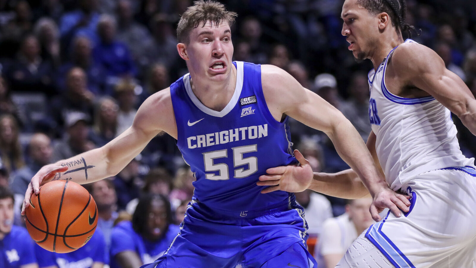 Creighton Bluejays guard Baylor Scheierman (55) dribbles against Xavier Musketeers guard Desmond Claude (1) in the first half at Cintas Center.