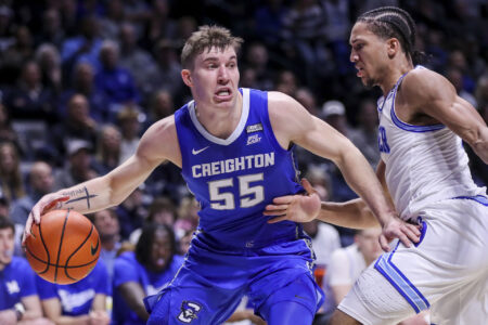 Creighton Bluejays guard Baylor Scheierman (55) dribbles against Xavier Musketeers guard Desmond Claude (1) in the first half at Cintas Center.