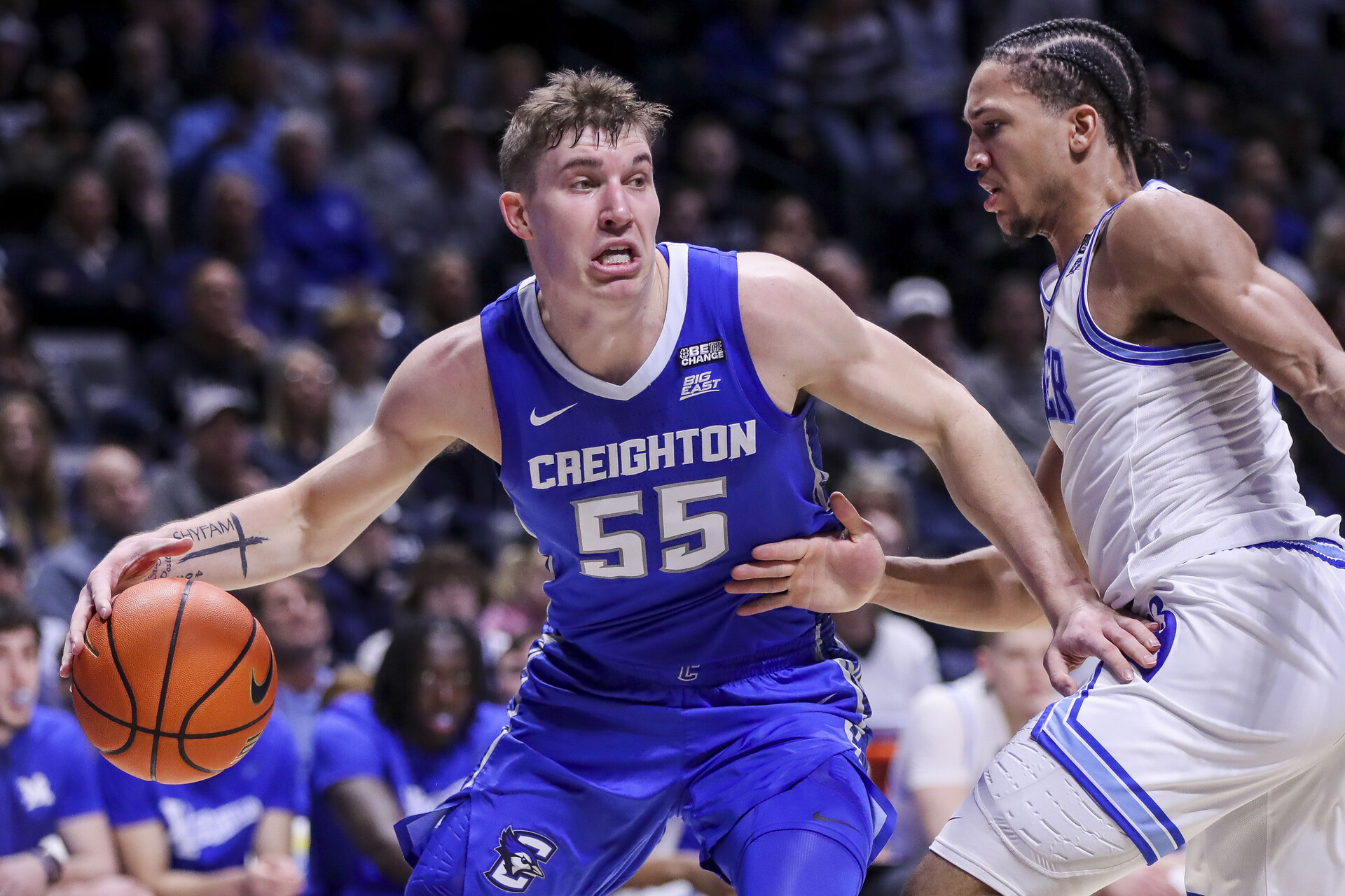 Creighton Bluejays guard Baylor Scheierman (55) dribbles against Xavier Musketeers guard Desmond Claude (1) in the first half at Cintas Center.