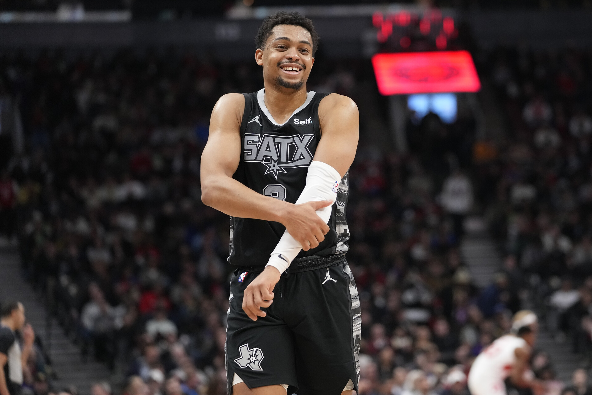 Feb 12, 2024; Toronto, Ontario, CAN; San Antonio Spurs forward Keldon Johnson (3) reacts after a play against the Toronto Raptors during the second half at Scotiabank Arena.