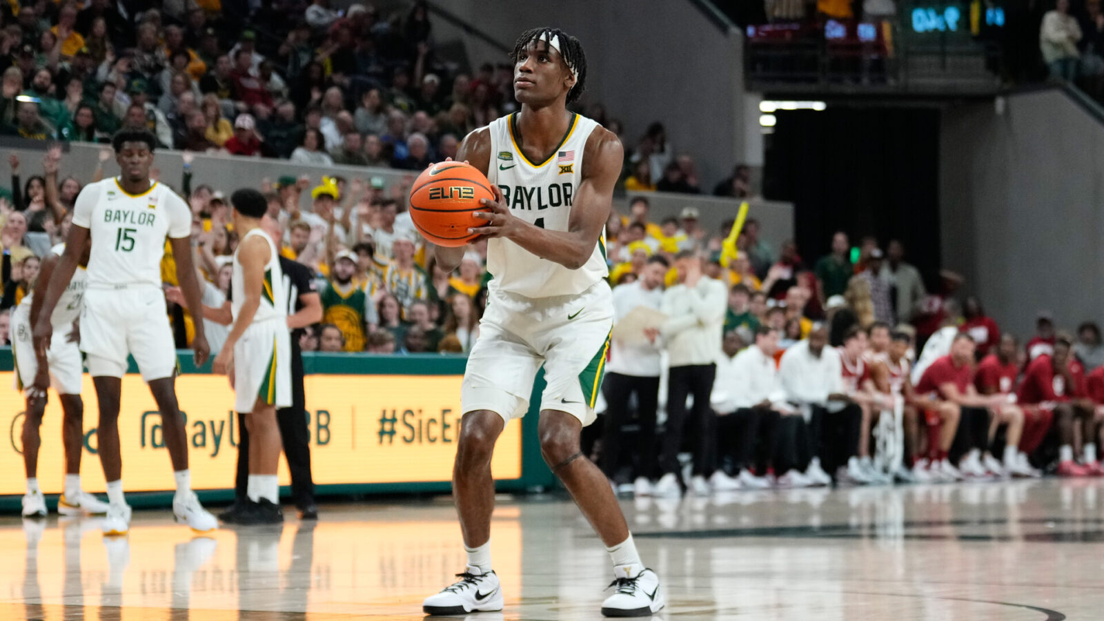 Feb 13, 2024; Waco, Texas, USA; Baylor Bears guard Ja'Kobe Walter (4) shoots a technical free throw against the Oklahoma Sooners during the second half at Paul and Alejandra Foster Pavilion.