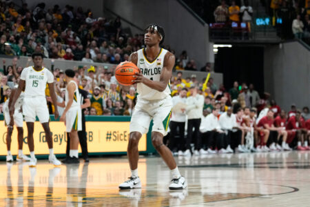 Feb 13, 2024; Waco, Texas, USA; Baylor Bears guard Ja'Kobe Walter (4) shoots a technical free throw against the Oklahoma Sooners during the second half at Paul and Alejandra Foster Pavilion.
