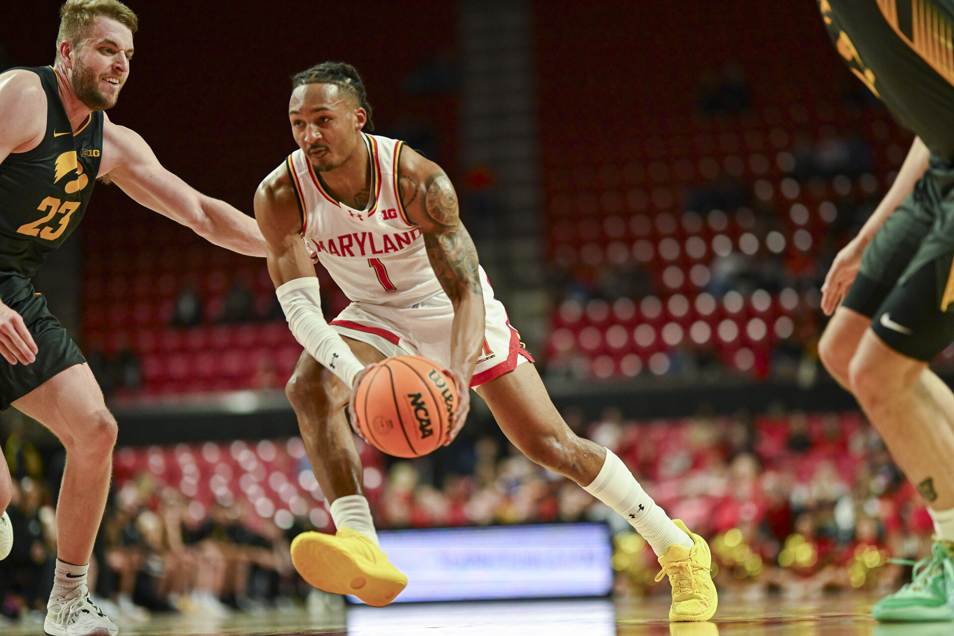 Feb 14, 2024; College Park, Maryland, USA; Maryland Terrapins guard Jahmir Young (1) makes a m move to there basket on Iowa Hawkeyes forward Ben Krikke (23) during the second half at Xfinity Center.