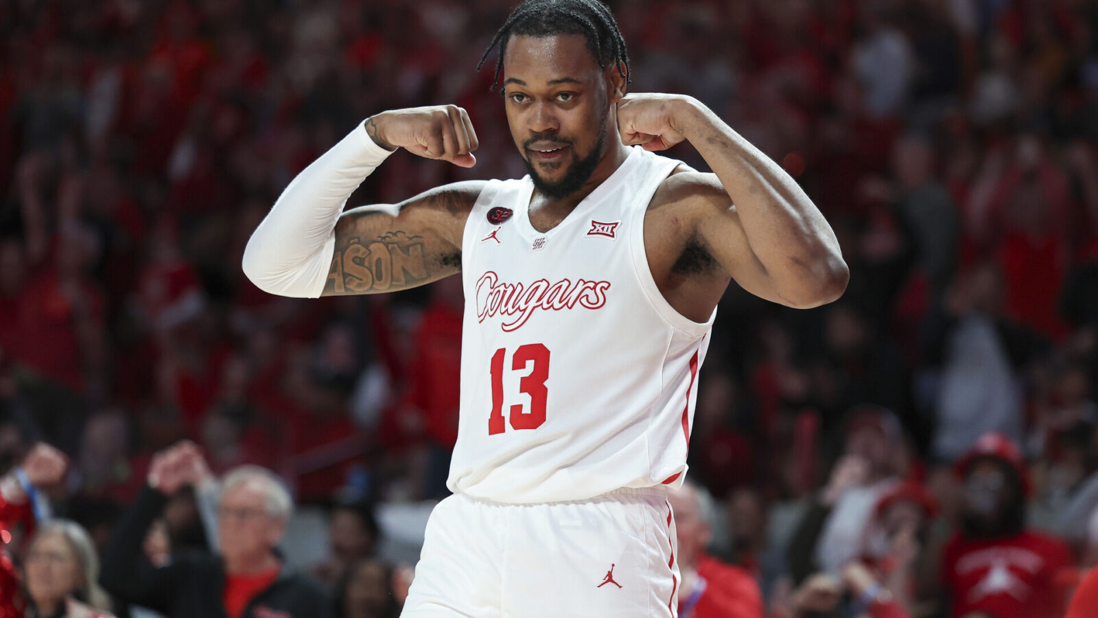 Feb 17, 2024; Houston, Texas, USA; Houston Cougars forward J'Wan Roberts (13) reacts after a play during the second half against the Texas Longhorns at Fertitta Center.