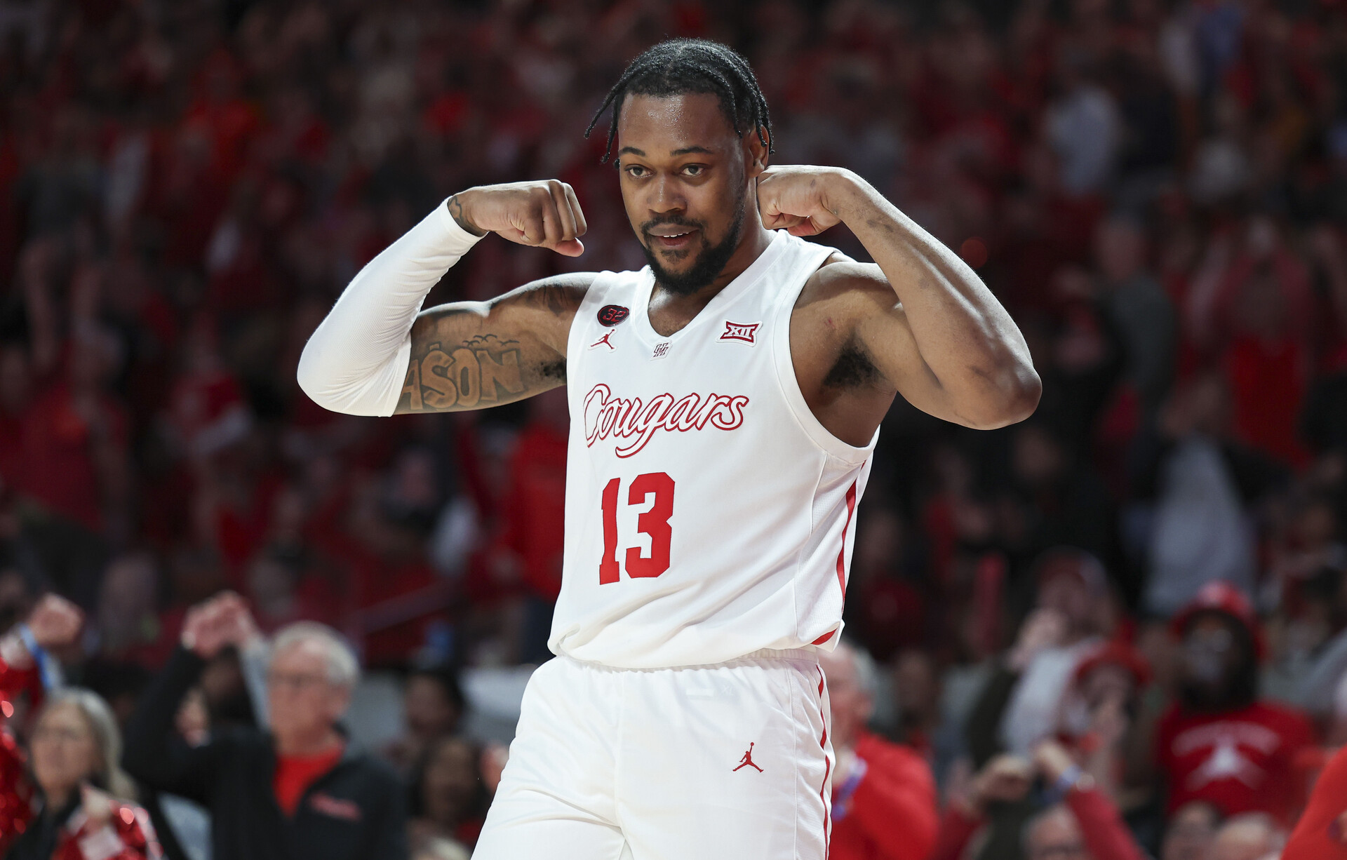 Feb 17, 2024; Houston, Texas, USA; Houston Cougars forward J'Wan Roberts (13) reacts after a play during the second half against the Texas Longhorns at Fertitta Center.