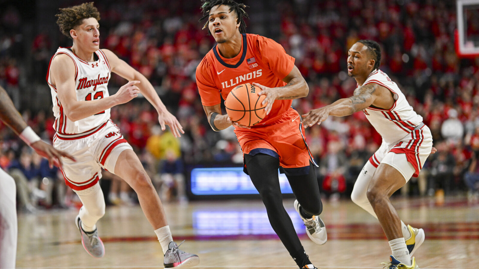 Feb 17, 2024; College Park, Maryland, USA; Illinois Fighting Illini guard Terrence Shannon Jr. (0) makes a move to the basket during the first half against the Maryland Terrapins at Xfinity Center.