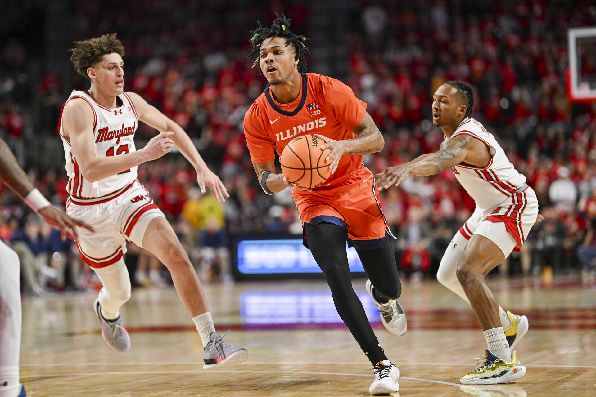 Feb 17, 2024; College Park, Maryland, USA; Illinois Fighting Illini guard Terrence Shannon Jr. (0) makes a move to the basket during the first half against the Maryland Terrapins at Xfinity Center.