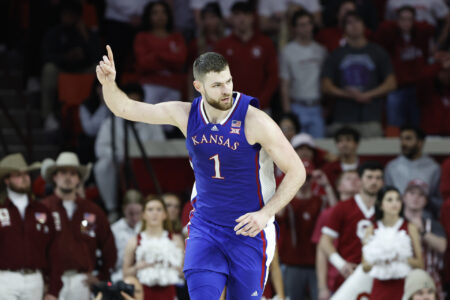 Feb 17, 2024; Norman, Oklahoma, USA; Kansas Jayhawks center Hunter Dickinson (1) gestures after scoring a basket against the Oklahoma Sooners during the second half at Lloyd Noble Center.