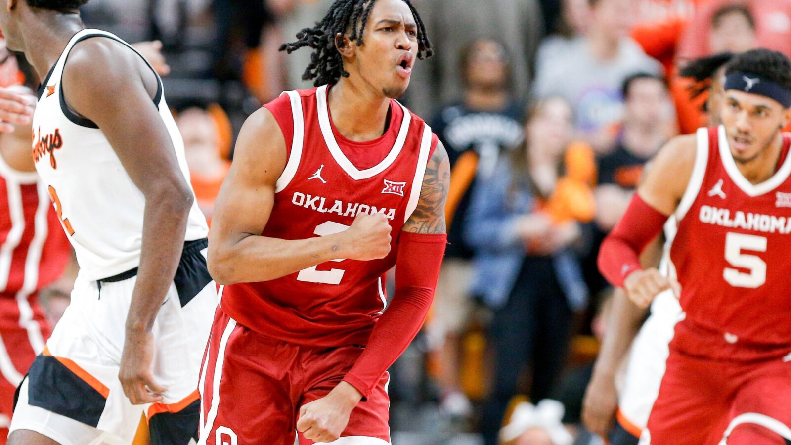 Oklahoma guard Javian McCollum (2) celebrates scoring in the second half during an NCAA basketball game between Oklahoma and Oklahoma State in Stillwater, Okla., on Saturday, Feb. 24, 2024.