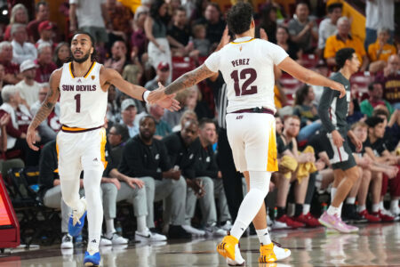 Feb 24, 2024; Tempe, Arizona, USA; Arizona State Sun Devils guard Frankie Collins (1) slaps hands with Arizona State Sun Devils guard Jose Perez (12) during the first half of the game against the Washington State Cougars at Desert Financial Arena.