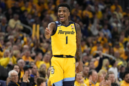 Feb 25, 2024; Milwaukee, Wisconsin, USA; Marquette Golden Eagles guard Kam Jones (1) reacts after scoring a a basket during the second half against the Xavier Musketeers at Fiserv Forum.