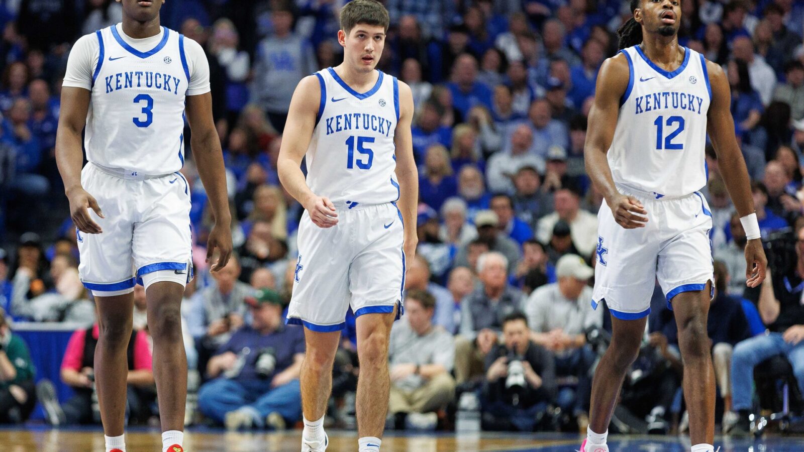 Feb 24, 2024; Lexington, Kentucky, USA; Kentucky Wildcats guards Adou Thiero (3), Reed Sheppard (15) and Antonio Reeves (12) return to the bench during the first half against the Alabama Crimson Tide at Rupp Arena at Central Bank Center.