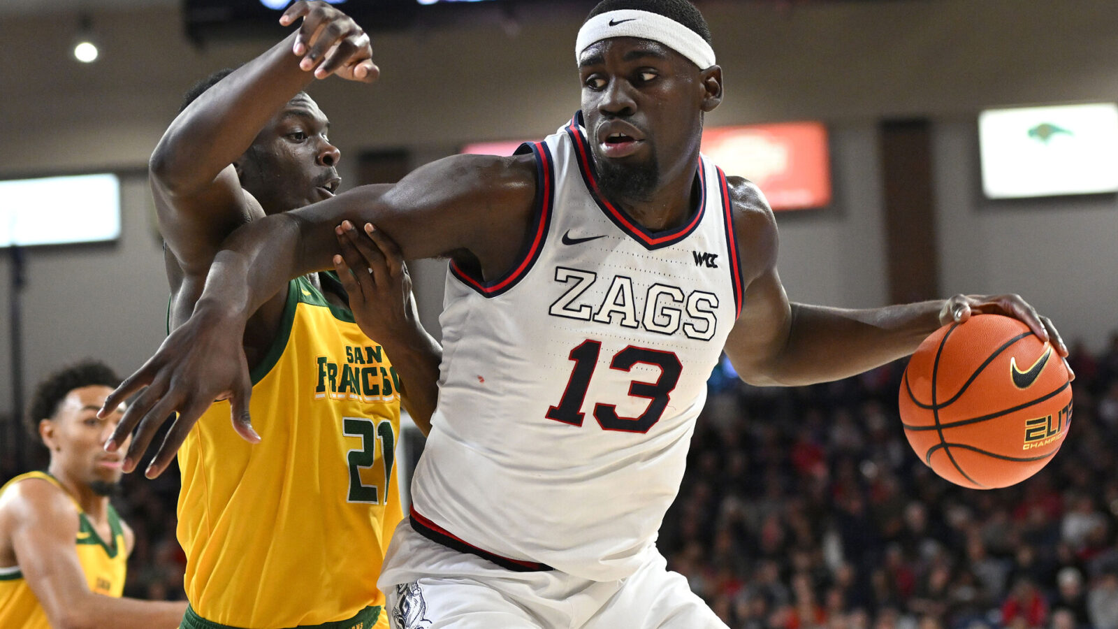 an 25, 2024; Spokane, Washington, USA; Gonzaga Bulldogs forward Graham Ike (13) controls the ball against San Francisco Dons forward Ndewedo Newbury (21) in the first half at McCarthey Athletic Center.