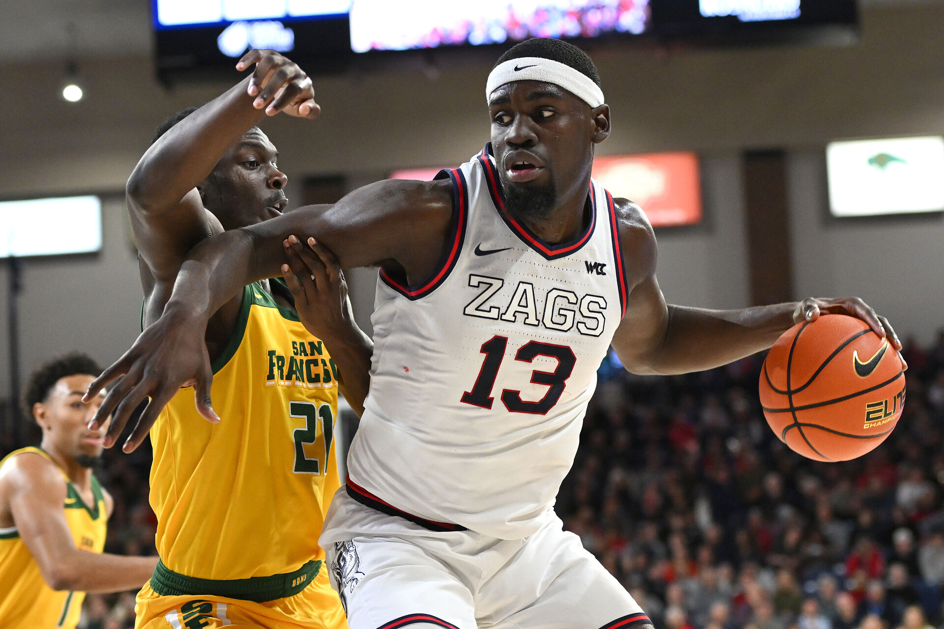 an 25, 2024; Spokane, Washington, USA; Gonzaga Bulldogs forward Graham Ike (13) controls the ball against San Francisco Dons forward Ndewedo Newbury (21) in the first half at McCarthey Athletic Center.