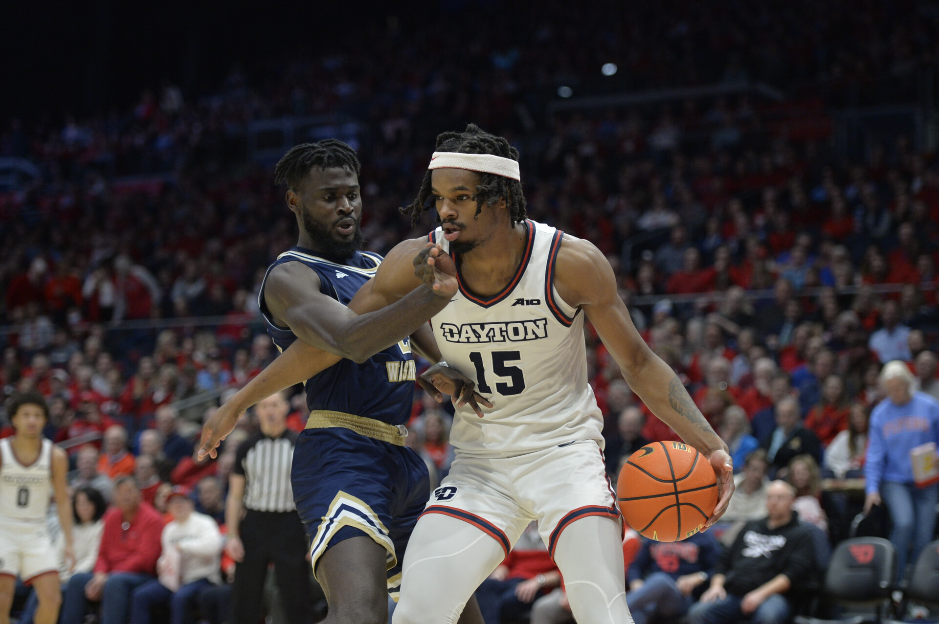 Jan 30, 2024; Dayton, Ohio, USA; Dayton Flyers forward DaRon Holmes II (15) drives to the basket against George Washington center Babatunde Akingbola (23) during a game at University of Dayton Arena.