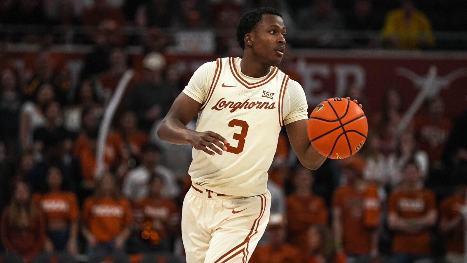 Texas Longhorns guard Max Abmas (3) dribles the ball towards the West Virginia basket during the basketball game at the Moody Center on Saturday, Feb. 10, 2024 in Austin.