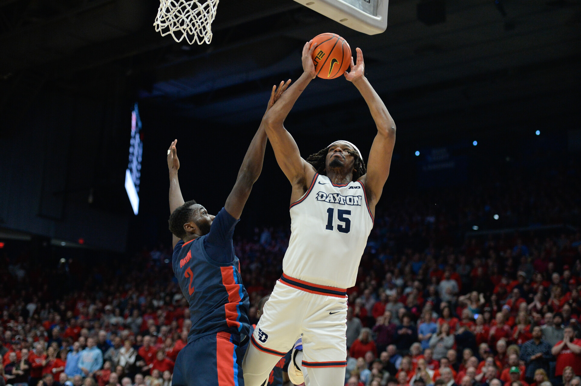 Feb 13, 2024; Dayton, Ohio, USA; Dayton Flyers forward DaRon Holmes II (15) shoots the ball against Duquesne forward David Dixon (2) during the game at University of Dayton Arena.