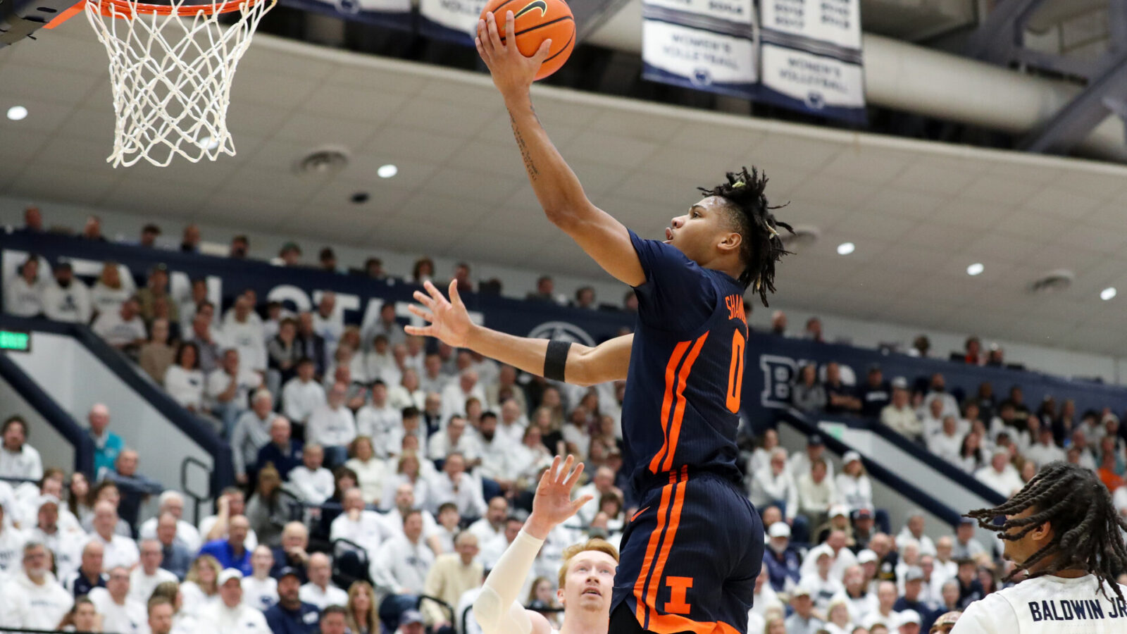 Feb 21, 2024; University Park, Pennsylvania, USA; Illinois Fighting Illini guard Terrence Shannon Jr (0) drives during the first half against the Penn State Nittany Lions at Rec Hall.