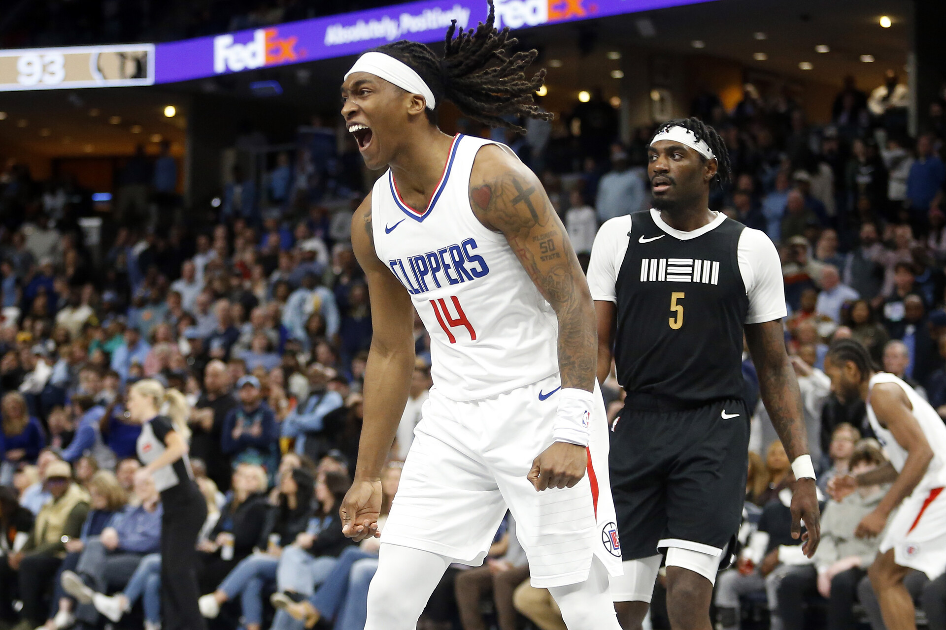 Feb 23, 2024; Memphis, Tennessee, USA; Los Angeles Clippers guard Terance Mann (14) reacts after a dunk during the second half against the Memphis Grizzlies at FedExForum.