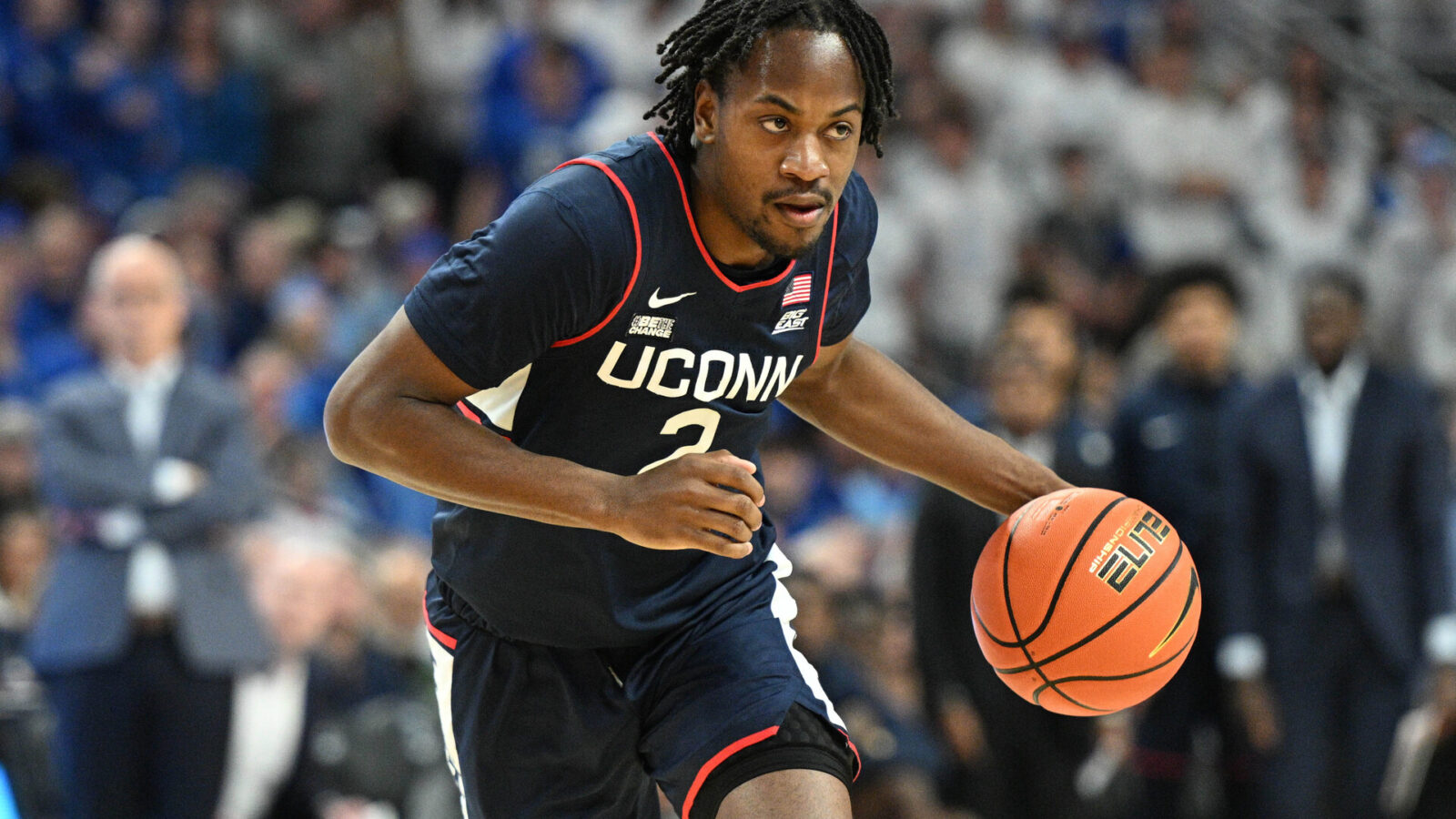 Feb 20, 2024; Omaha, Nebraska, USA; Connecticut Huskies guard Tristen Newton (2) dribbles against the Creighton Bluejays in the first half at CHI Health Center Omaha.