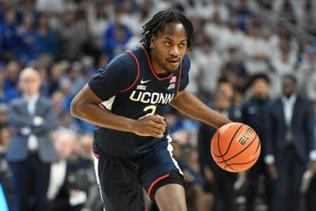 Feb 20, 2024; Omaha, Nebraska, USA; Connecticut Huskies guard Tristen Newton (2) dribbles against the Creighton Bluejays in the first half at CHI Health Center Omaha.