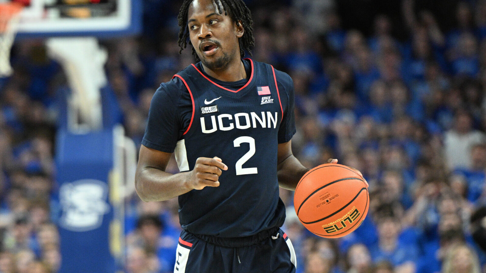 Feb 20, 2024; Omaha, Nebraska, USA; Connecticut Huskies guard Tristen Newton (2) dribbles against the Creighton Bluejays in the first half at CHI Health Center Omaha.