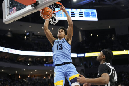 Feb 28, 2024; Milwaukee, Wisconsin, USA; Marquette Golden Eagles forward Oso Ighodaro (13) dunks during the second half against the Providence Friars at Fiserv Forum.
