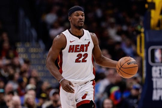 Miami Heat forward Jimmy Butler (22) dribbles the ball up court in the fourth quarter against the Denver Nuggets at Ball Arena.